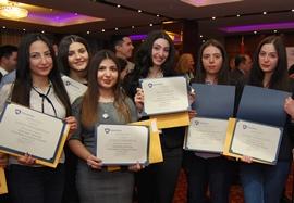 young women with certificates of course completion