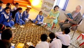 Mission Director John Groarke visited a school in Islamabad and read books with students. 
