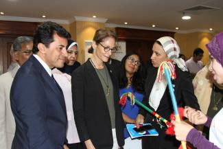 Mission Director Sherry F. Carlin and Minister of Youth and Sports Dr Ashraf Sobhy meet a young women that participates in the Meshwary project.