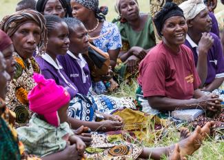 Women gather at a USAID-supported village savings and lending group.