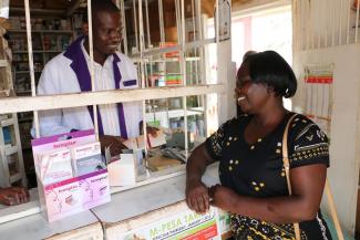 A woman consults with a pharmacist