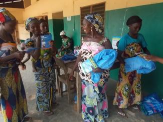 Expectant mothers receive long lasting insectide nets at public health clinic in Benin. Since 2007, USAID has provided over 5.8 
