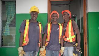 Three men wearing safety gear