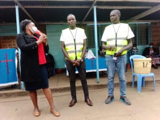 "Now, I have a way to help,” says Felix (center). He trains community members on early warning and early response mechanisms, in which he led alongside other peace volunteers. USAID Kenya