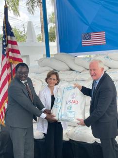 Ministry of Home Affairs Director of Refugee Services Sudi Exon Mwakibasi, World Food Program Country Representative Sarah Gordon-Gibson, and U.S. Ambassador to Tanzania Donald J. Wright welcome a $9 million contribution of food assistance to maintain critical food assistance to refugees in Tanzania.