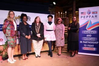 Six women representing the Ministry of Education and Training, U.S. President’s Emergency Plan for AIDS Relief (PEPFAR) and DREAMS initiative. 