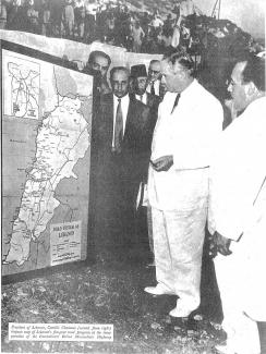 Lebanese President Camille Chamoun (2nd from right) inspects map of Lebanon’s five-year road program, co-funded by the U.S. and the Government of Lebanon Ministry of Public Works,-at the inauguration of the International Beirut Maameltein Highway, ca 1955