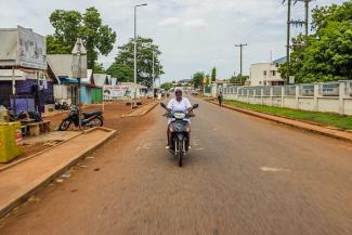Adama sometimes travels on her motorcycle to visit patients at their homes in northern Ghana. 