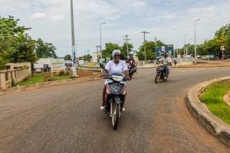Adama sometimes travels on her motorcycle to visit patients at their homes in northern Ghana. 