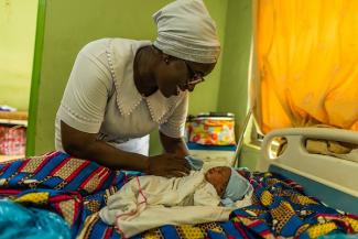 Adama visits a baby boy her patient gave birth to just four hours prior.