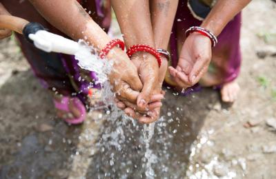 Women's hands being washed
