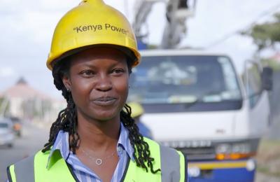 Grace Karuiru in her Kenya Power lineworker safety gear