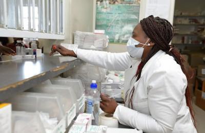 A pharmacist disbursing medicine at the Lesotho Defence Clinic (2021)