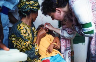 child receiving oral polio vaccine