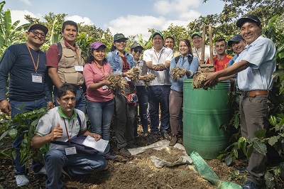 A group of people with compost